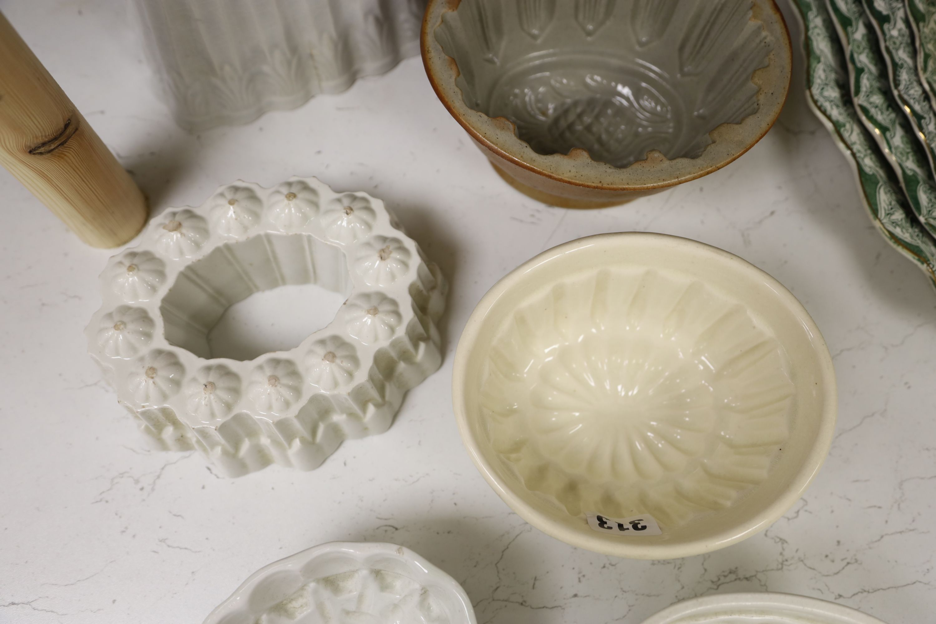 Six pottery jelly moulds including one Shelley